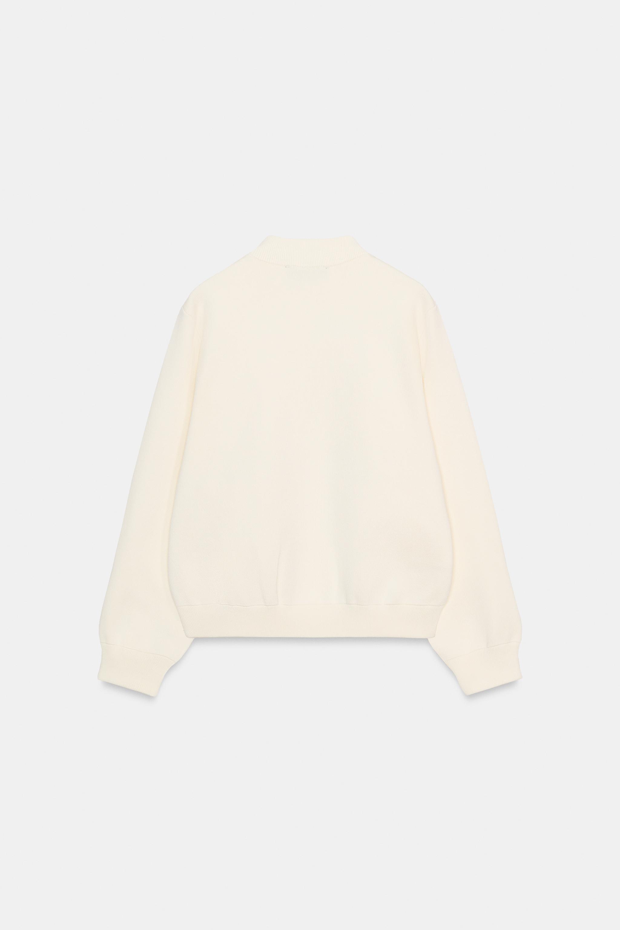 GILET EN MAILLE À BOUTON CONTRASTE